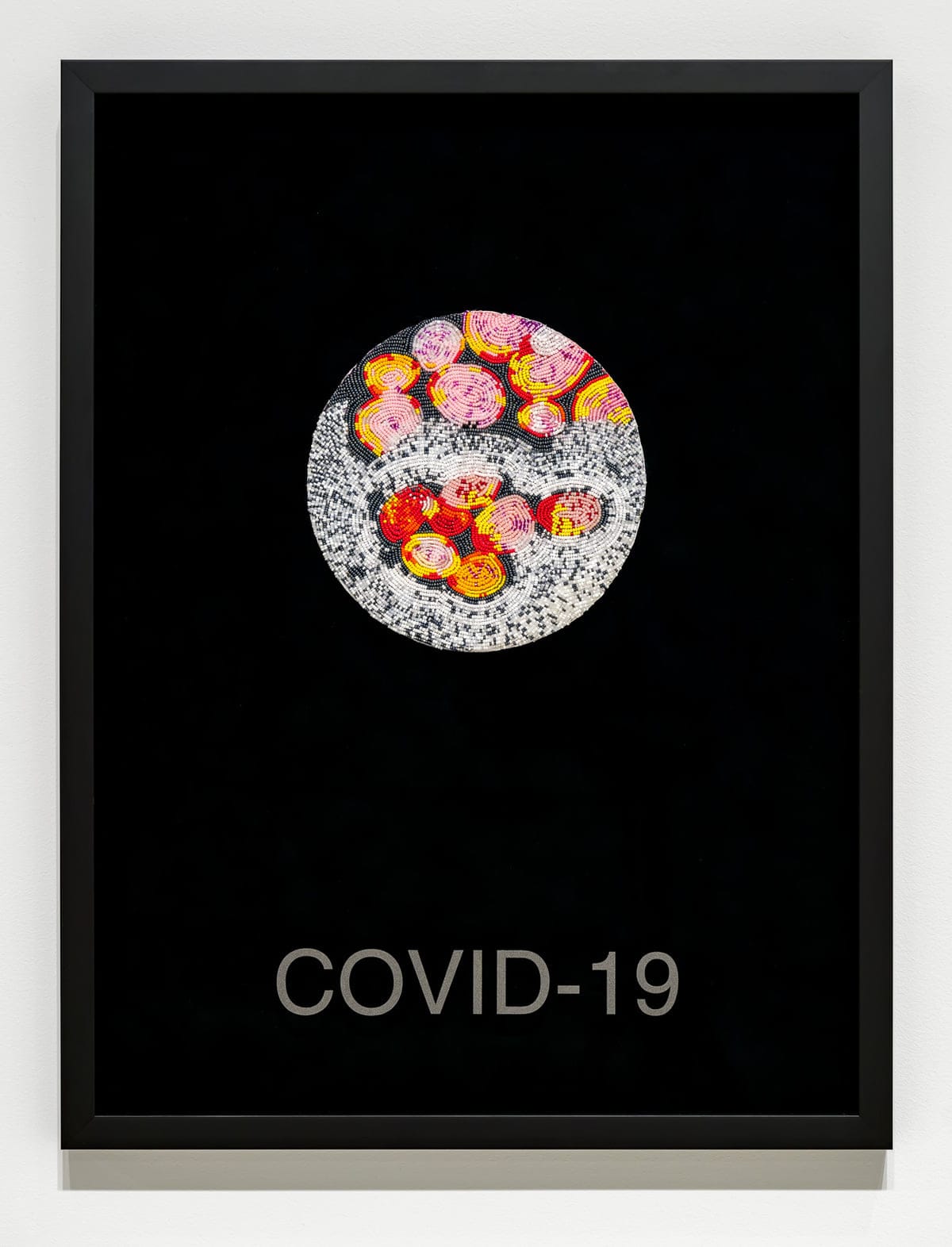 Ruth Cuthand, Second Wave: COVID-19, 2021, glass beads, backing and thread, vinyl lettering on glass. Courtesy of the artist.