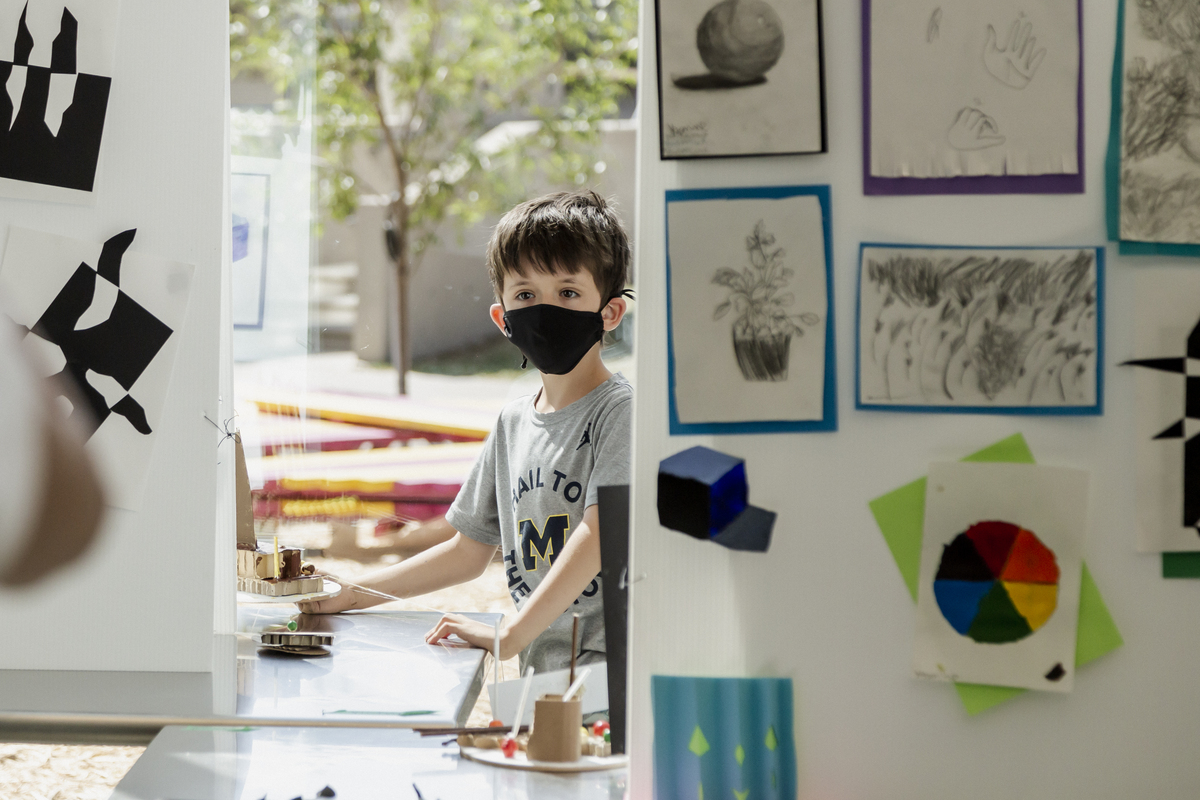 A child looks at art in the Remai Modern learning studio.