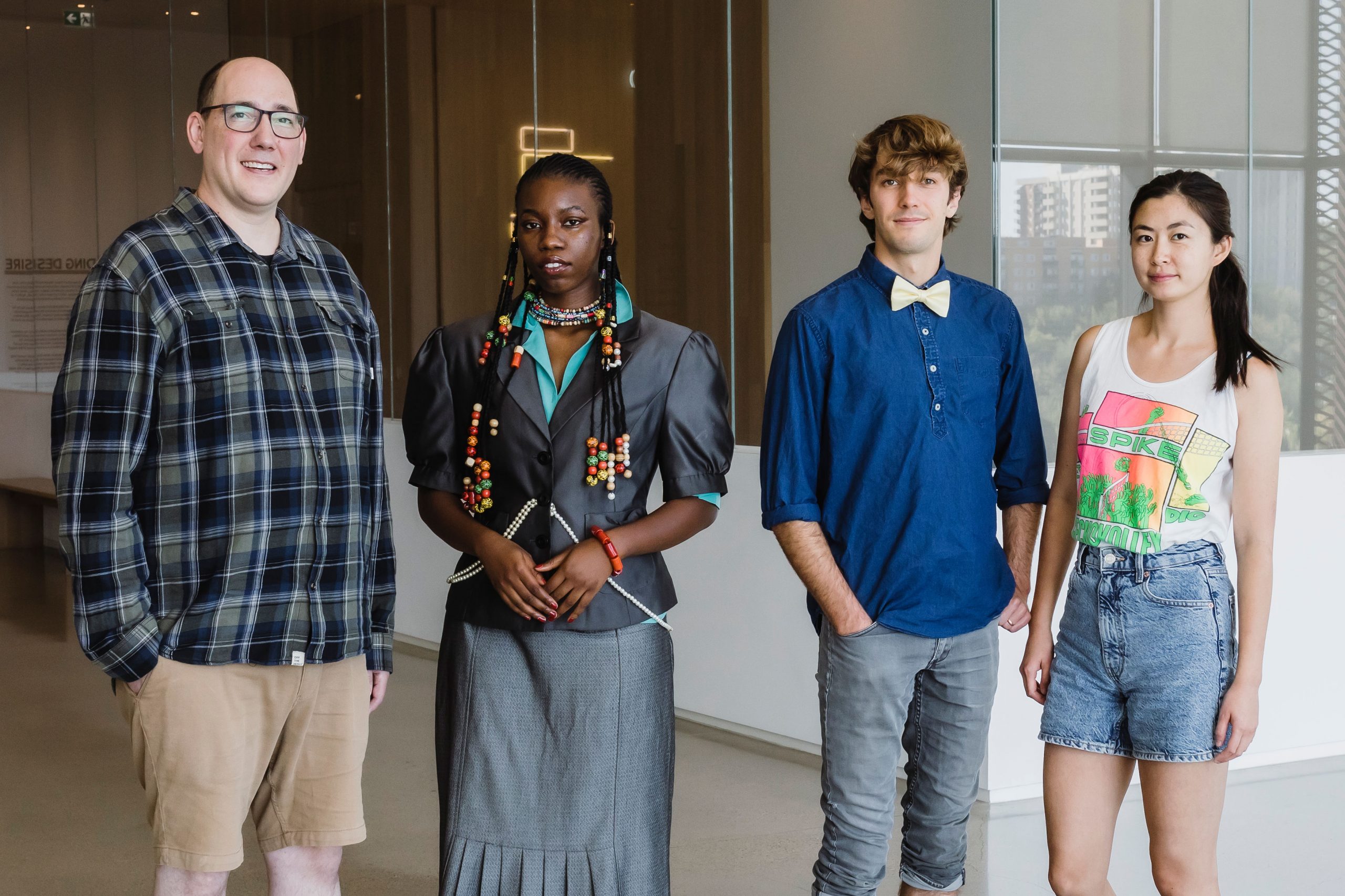 A group photo of four performance artists
