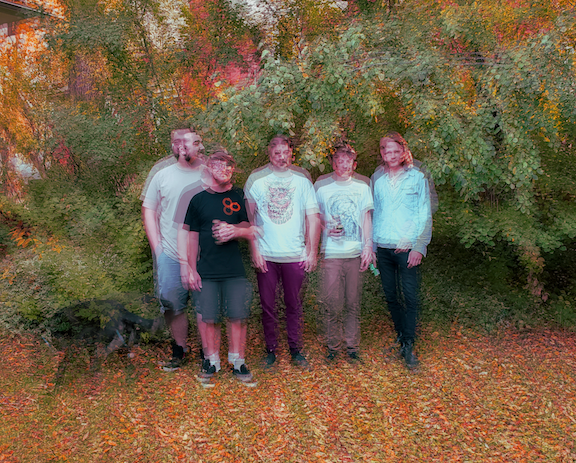 Blurred image of the band Shirley & The Pyramids.