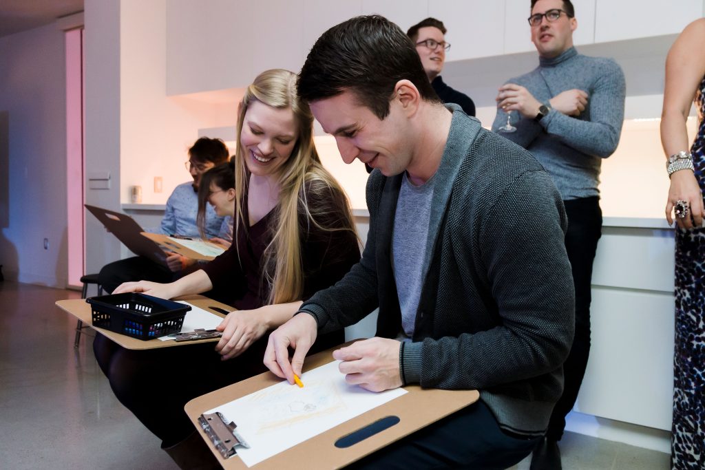 Two people enjoy life drawing in the museum's learning studio.