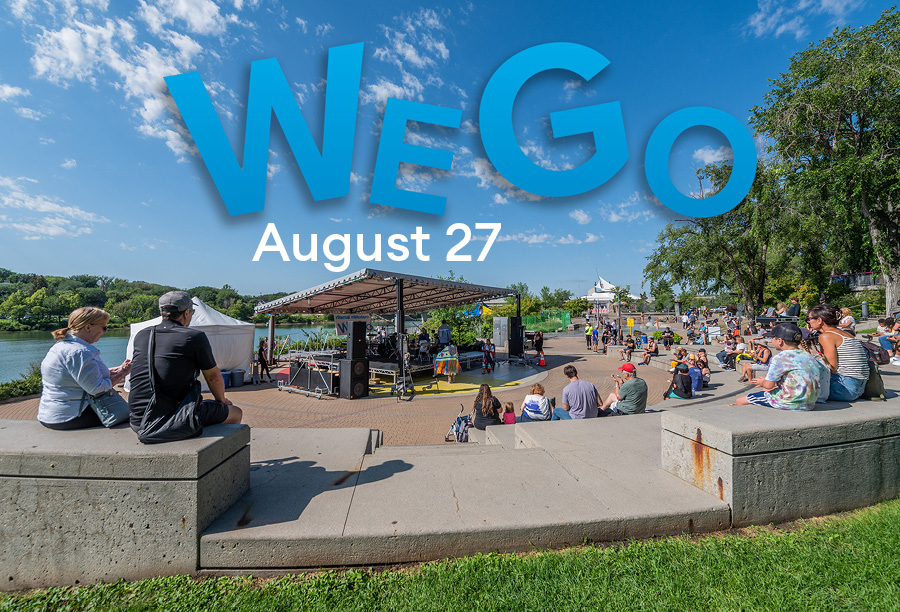 An image of an outdoor stage with a crowd gathered around it.