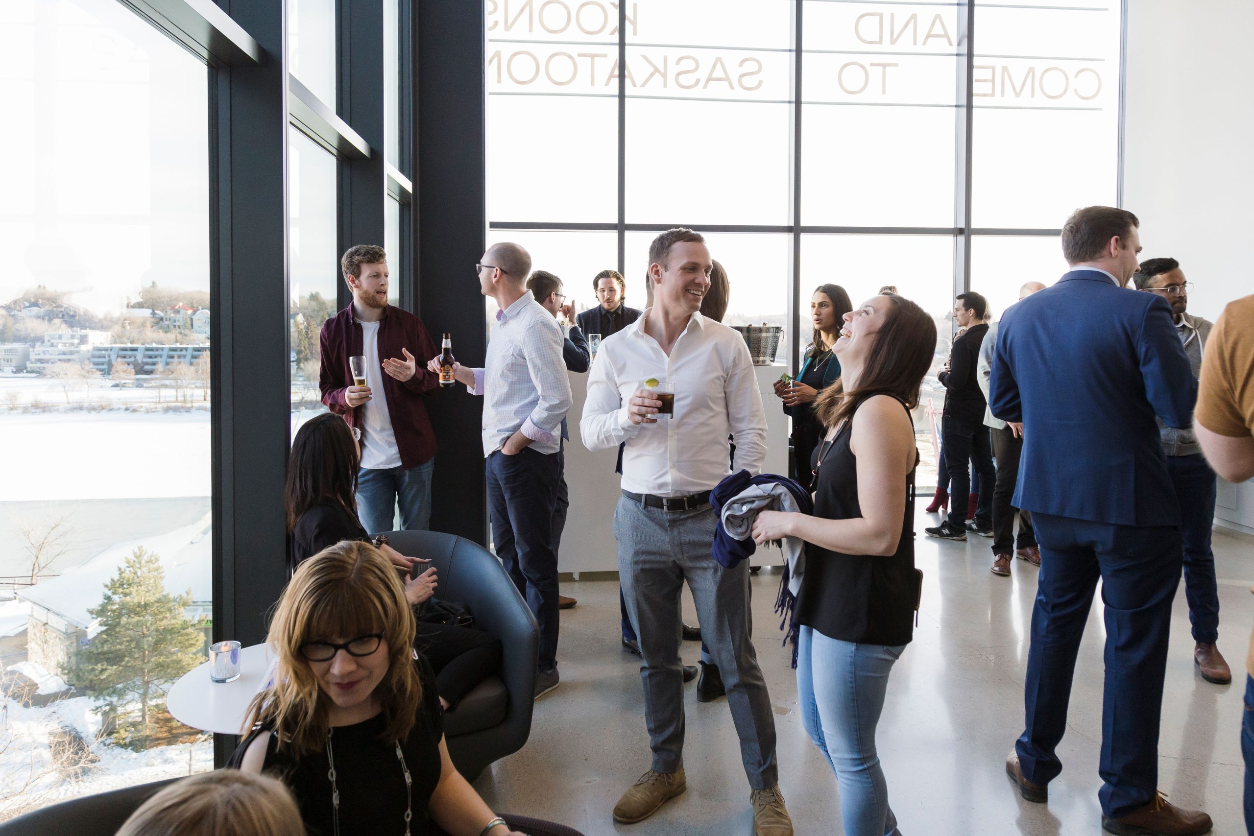 A small party taking place in Remai Modern's level 3 lounge
